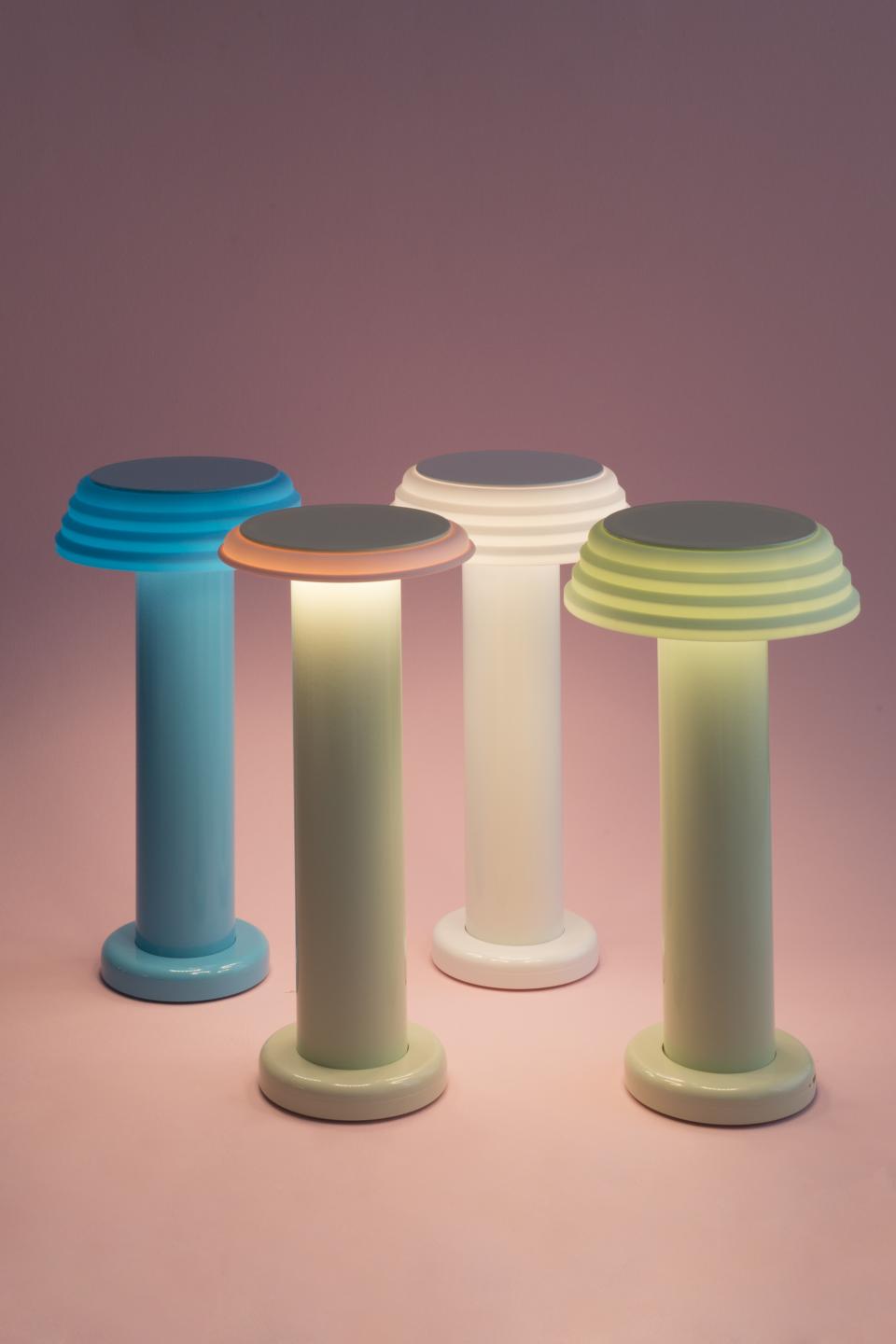 Colorful, modern lamps from the SowdenLight SHADES collection, showcasing diverse configurations against a soft pink background.