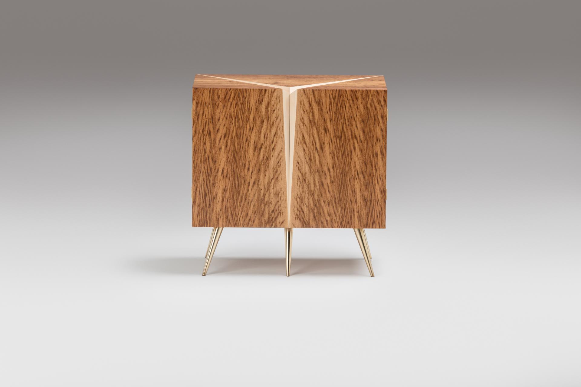 Modern wooden cabinet with unique geometric design and golden legs, showcased at London Craft Week 2020 by Laurent Peacock.