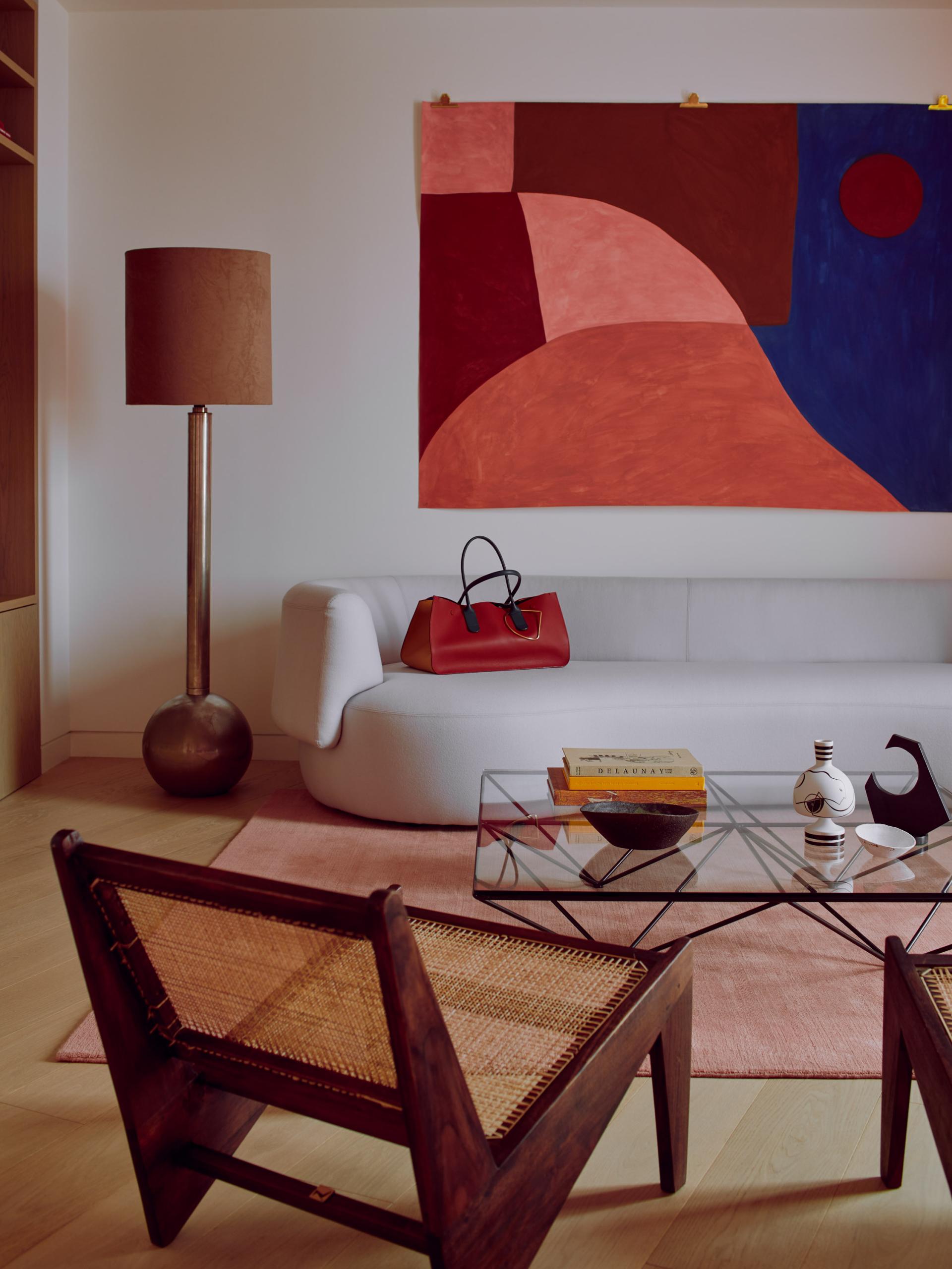 Stylish interior of Roksanda's penthouse featuring modern art, unique furniture, and a warm color palette.