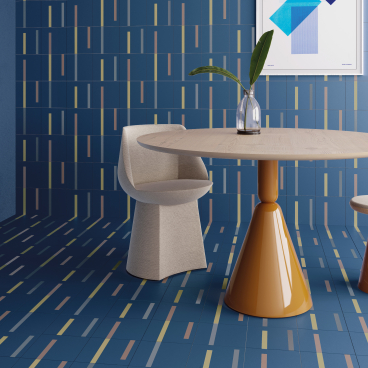 Modern interior featuring Raw Color's Dash tile with grid patterns, showcasing vibrant blue hues and stylish furniture design.
