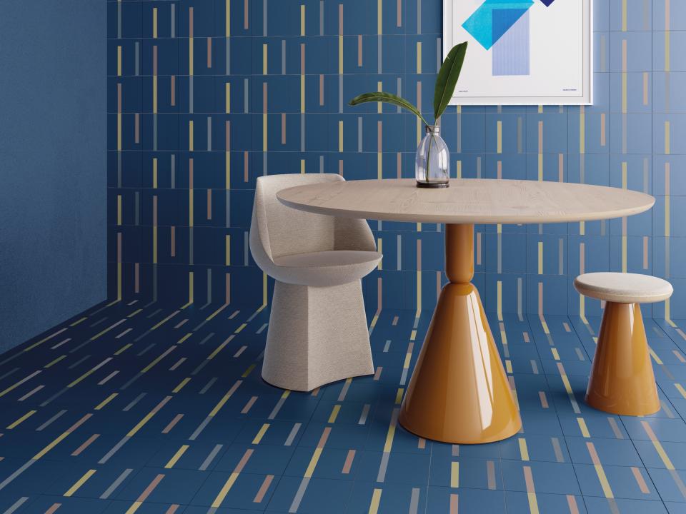 Modern interior featuring Raw Color's Dash tile with grid patterns, showcasing vibrant blue hues and stylish furniture design.