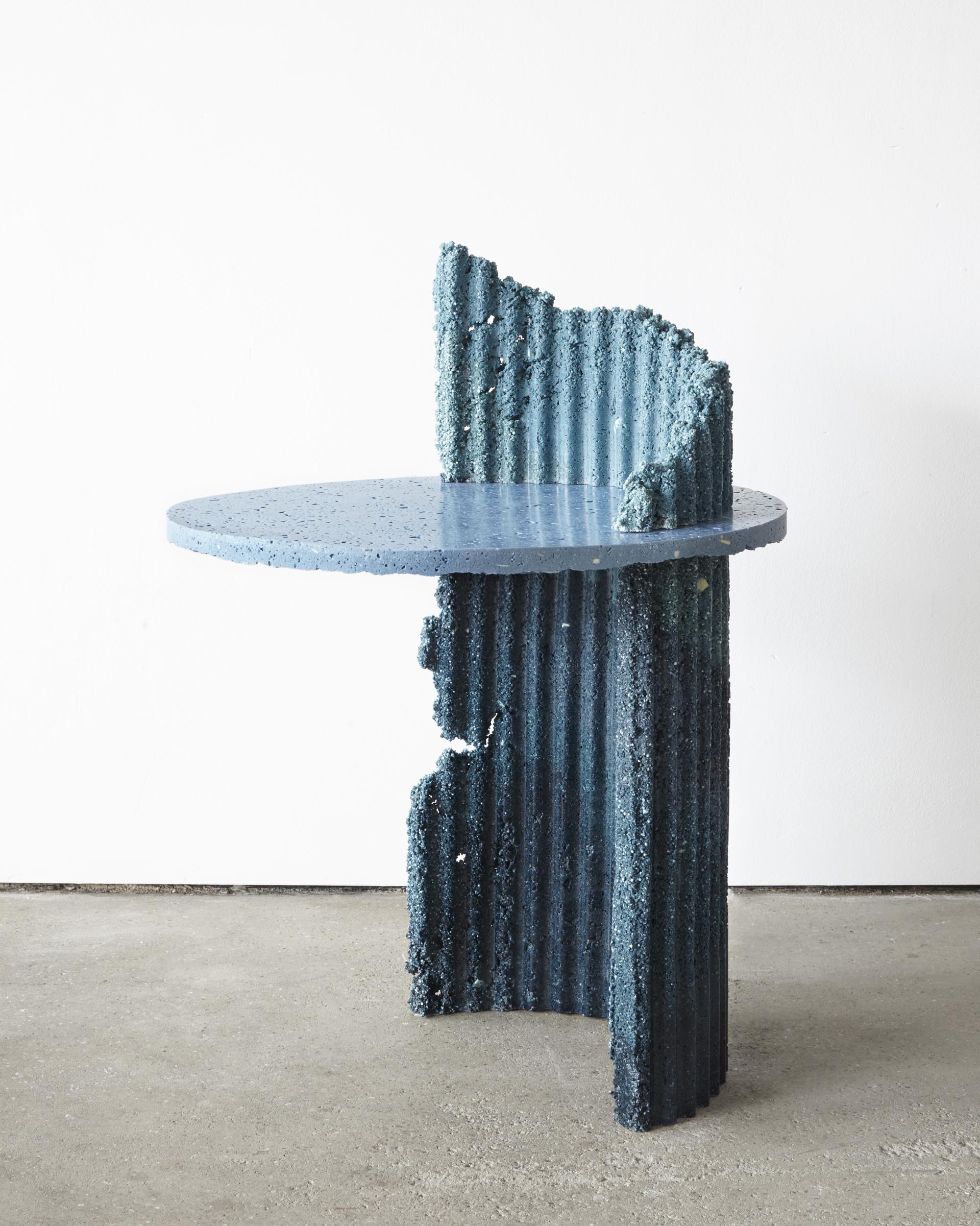 Unique blue table with a textured, irregular base, showcasing experimental design by UK-based artists at Hauser & Wirth.