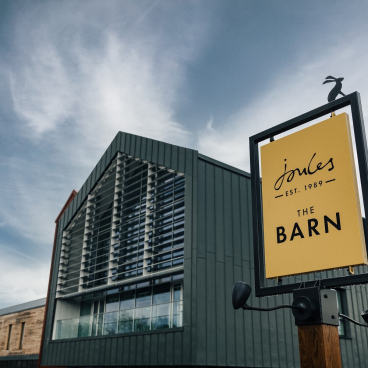 Stylish Joules sign at The Barn, showcasing the brand’s creative use of Crown Paints in a modern building.