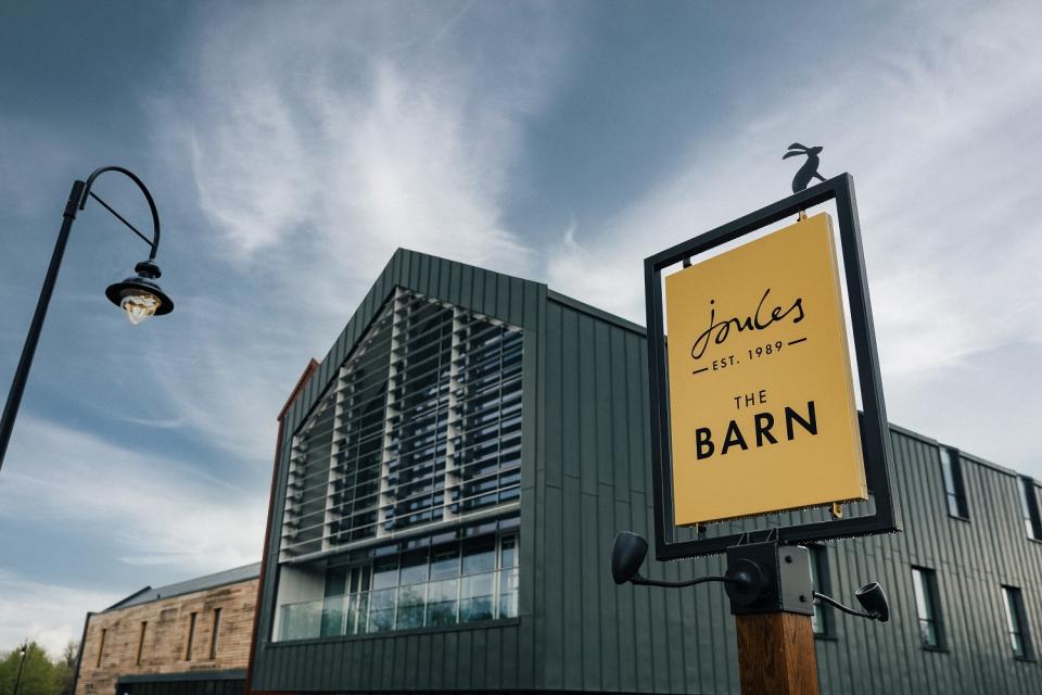 Stylish Joules sign at The Barn, showcasing the brand’s creative use of Crown Paints in a modern building.