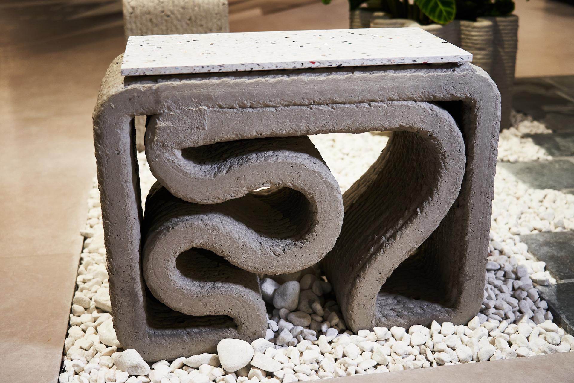 Sculptural concrete furniture piece showcases innovative design at Full Circle Concrete installation in Manchester.