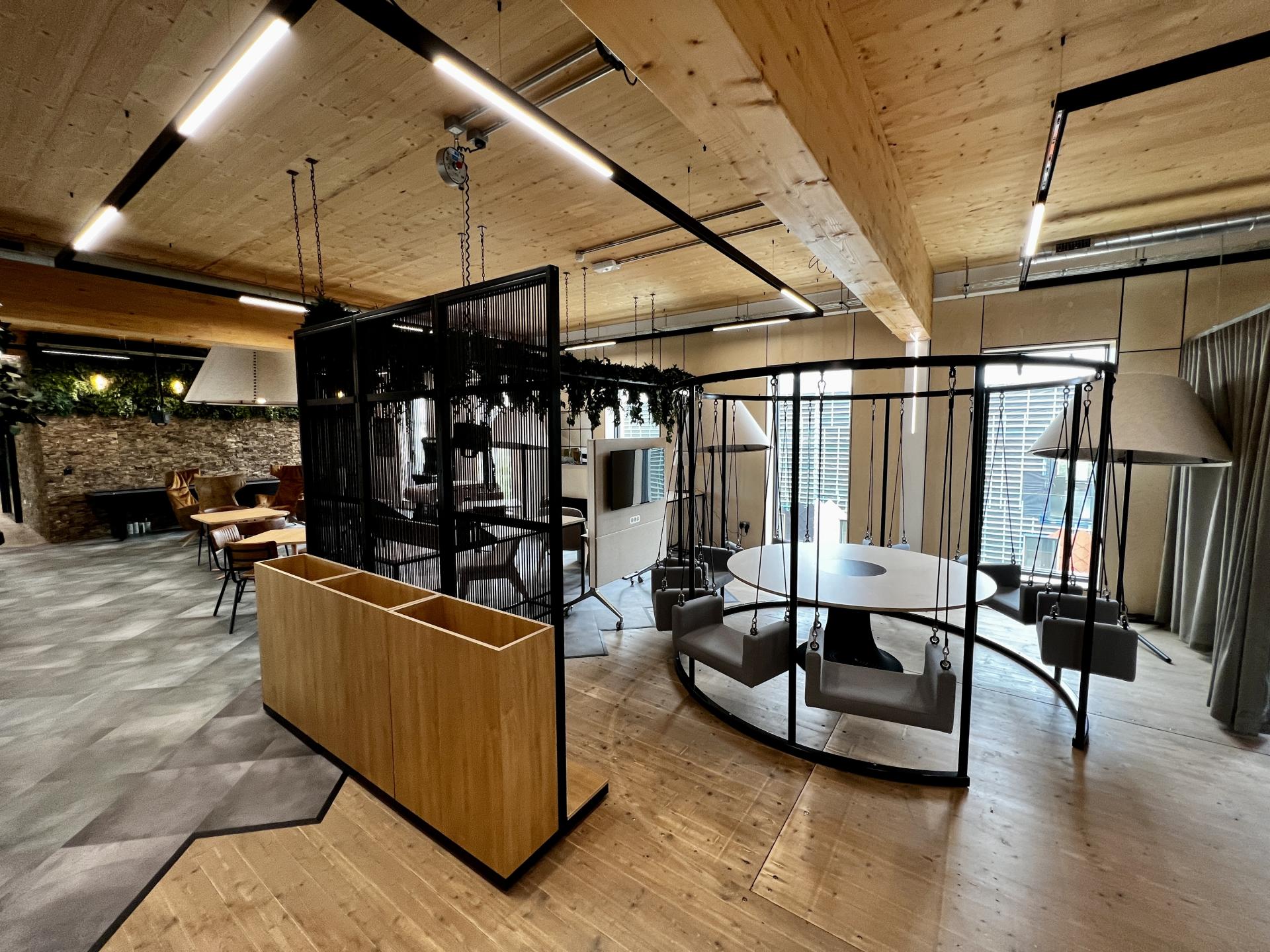 Contemporary net zero carbon workspace interior featuring innovative design elements and communal seating in Leeds.