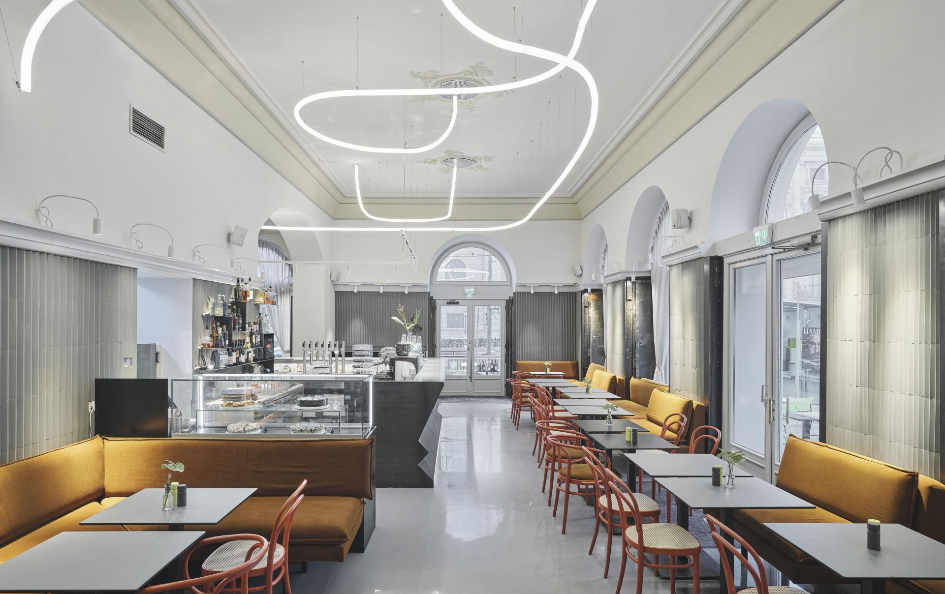 Modern interior of Café Bellaria in Vienna, featuring stylish furniture, a bright ambiance, and a charming coffee bar.