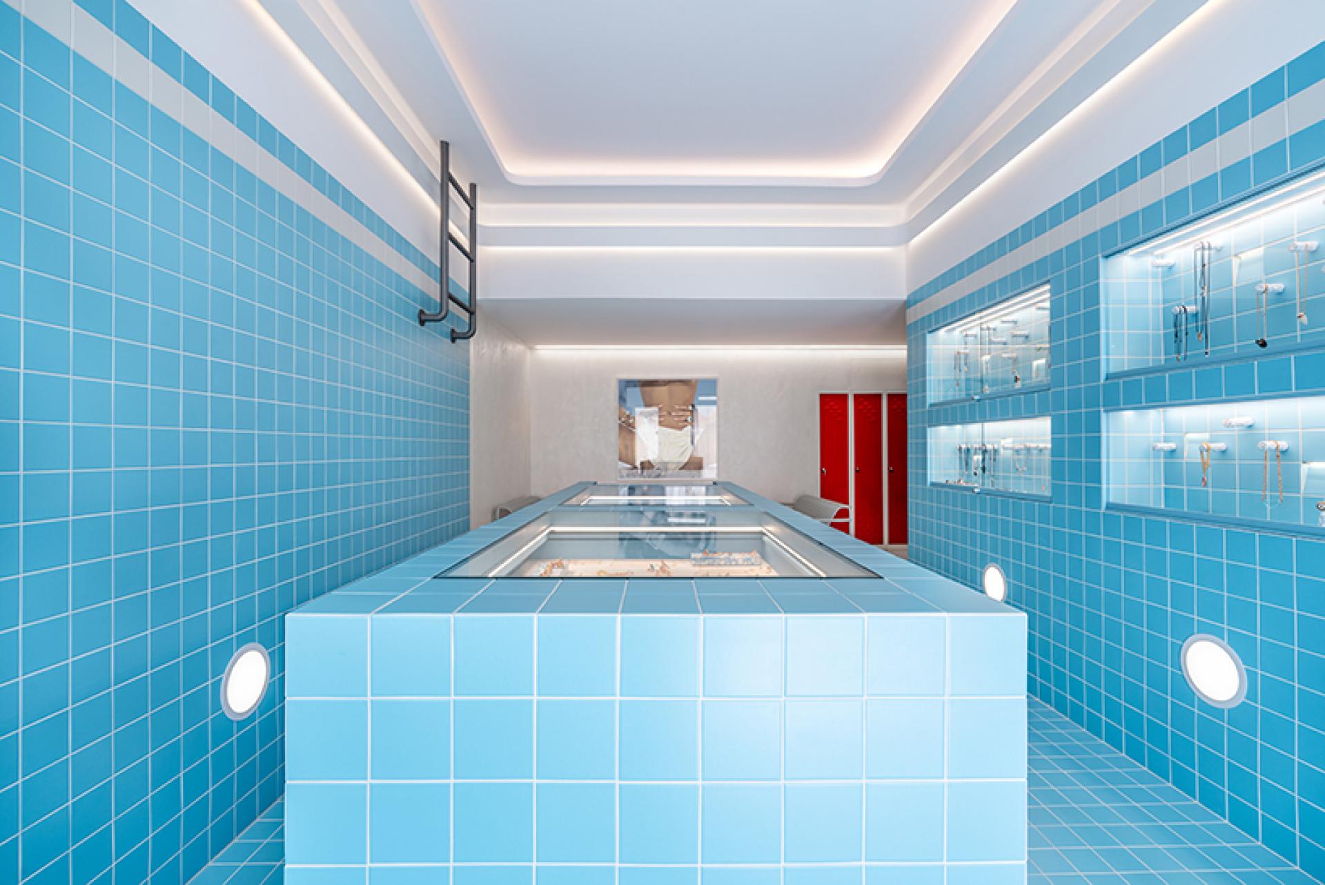 Vibrant blue tiled interior of a jewellery shop, inspired by a swimming pool design in Mykonos.