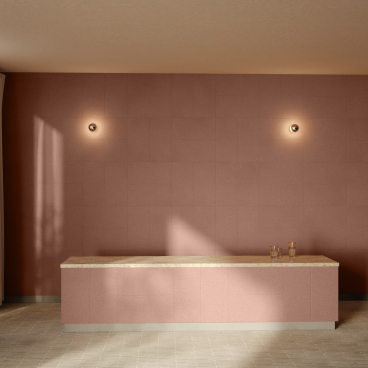 Elegant interior showcasing CornWall® material, featuring a soft pink wall and a stylish countertop.