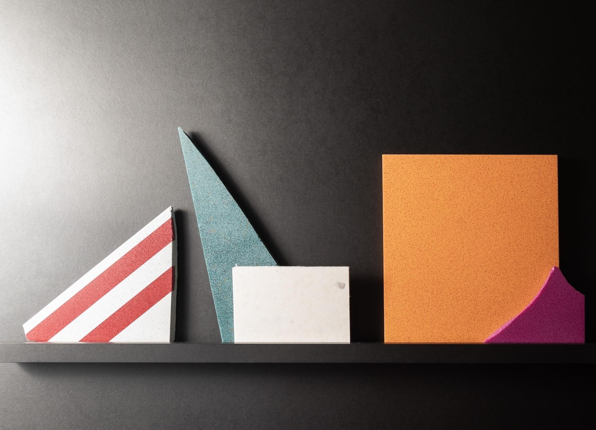 Vibrant architectural materials displayed in various geometric shapes, showcasing Surface Matter's circular Material Rescue initiative.