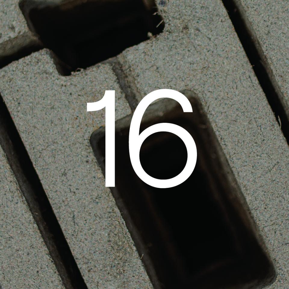 Close-up of a numbered section of concrete building material, highlighting sustainable construction practices.