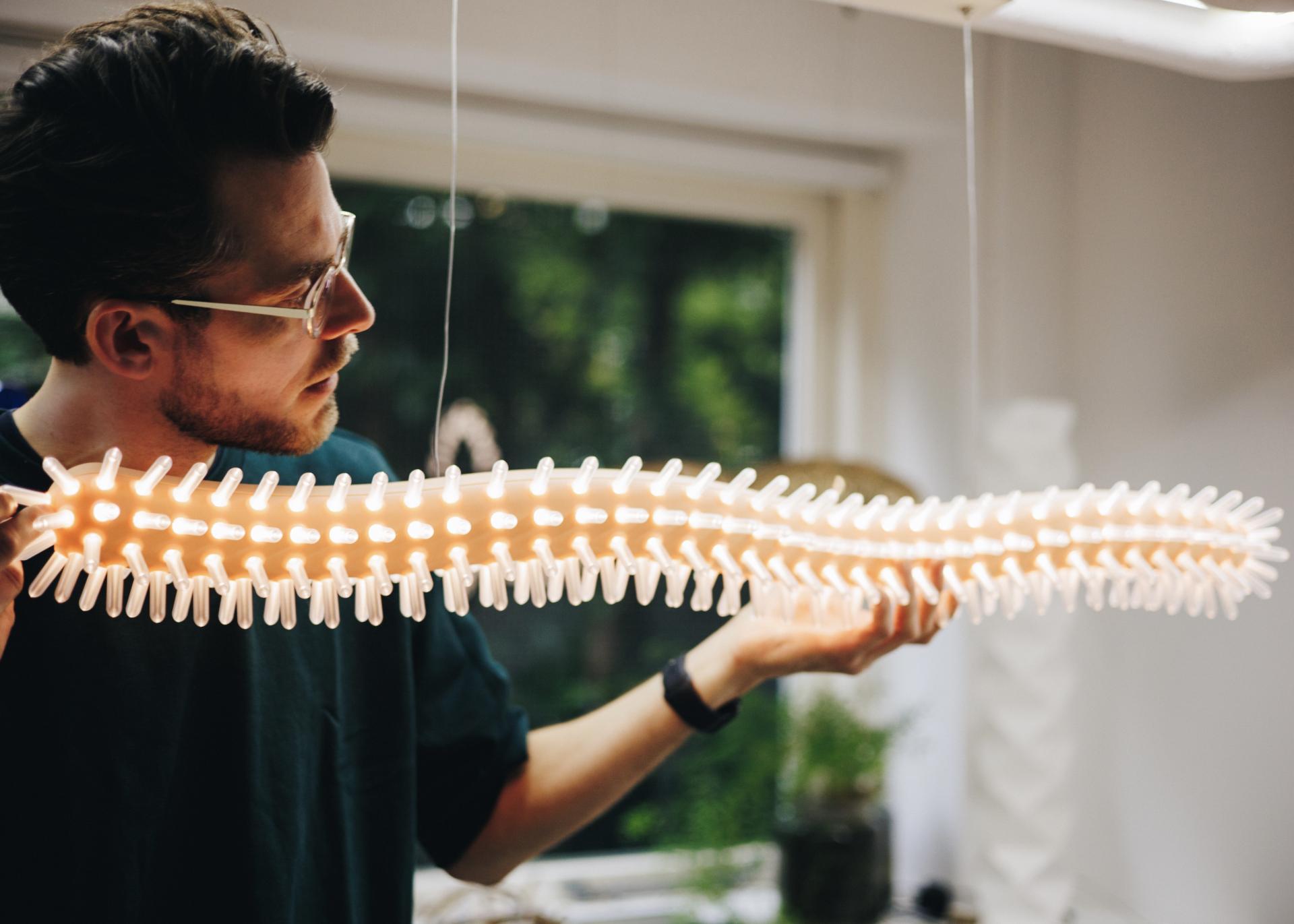 Ceramics-inspired lighting design showcased at Dutch Design Week 2023, highlighting playful colors and innovative craftsmanship.