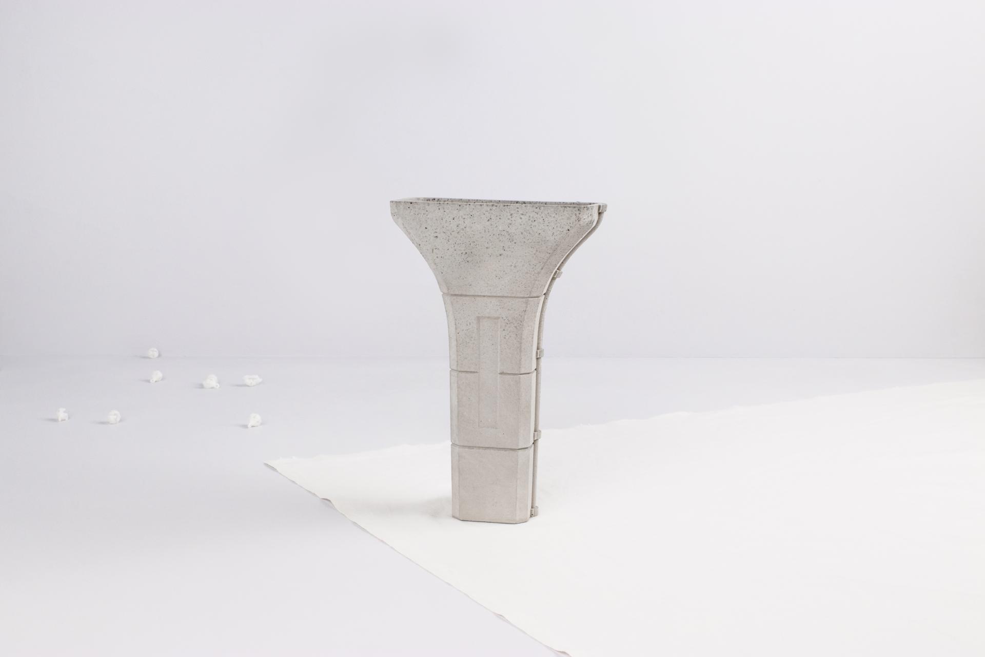 Concrete planter from Tiipoi's Siment collection, showcasing modern architectural design elements against a minimalist backdrop.