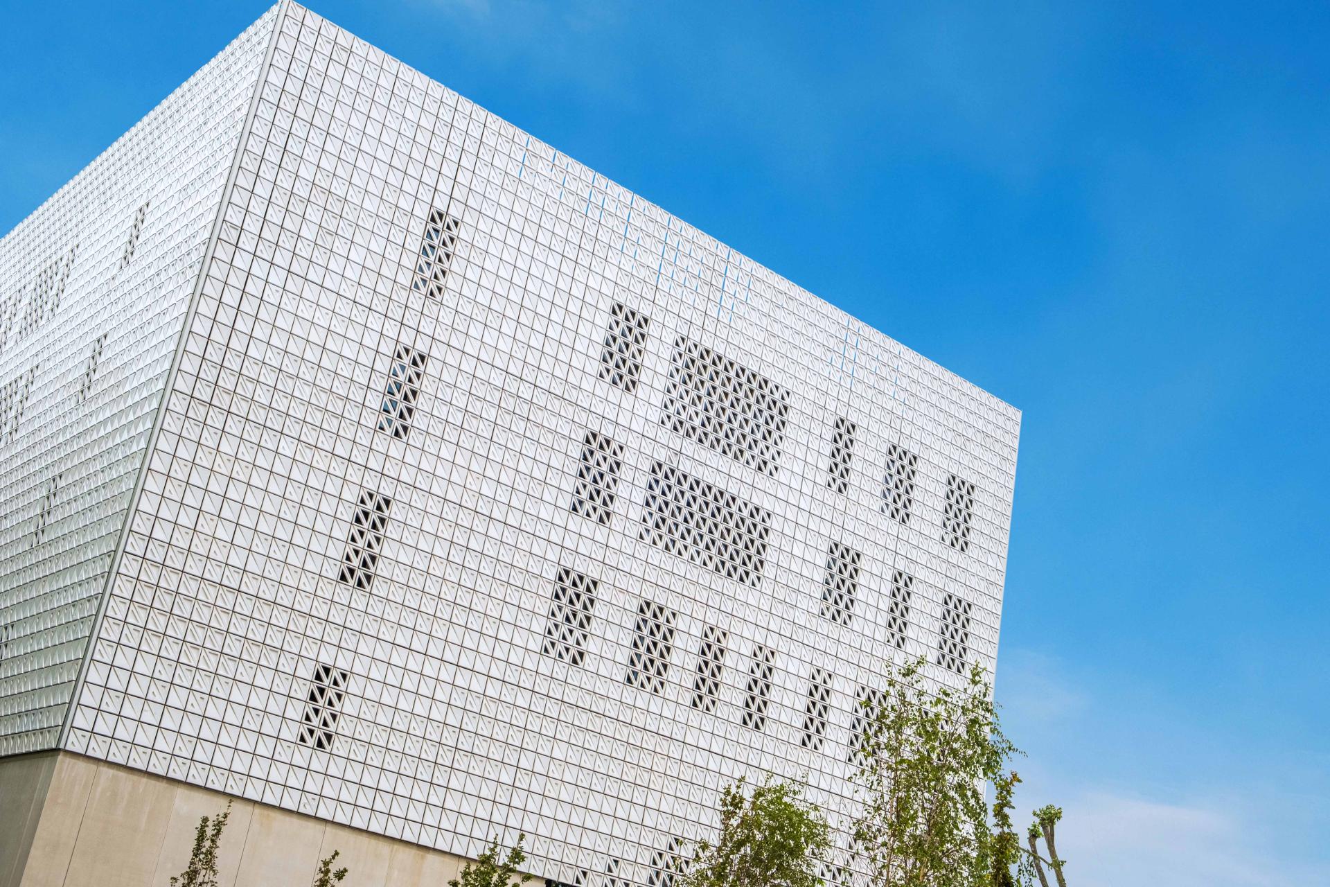 Ventilated ceramic façade of Elm House, Brighton University's business school, showcasing modern architecture and geometric patterns.