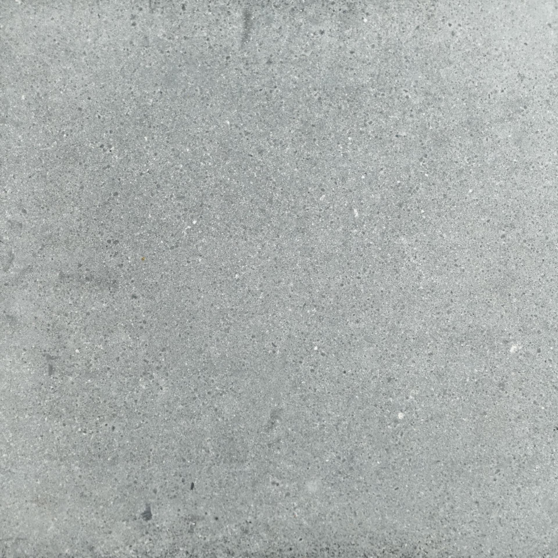 Smooth gray concrete surface, showcasing texture and natural variations, representing innovative materials in maker projects.