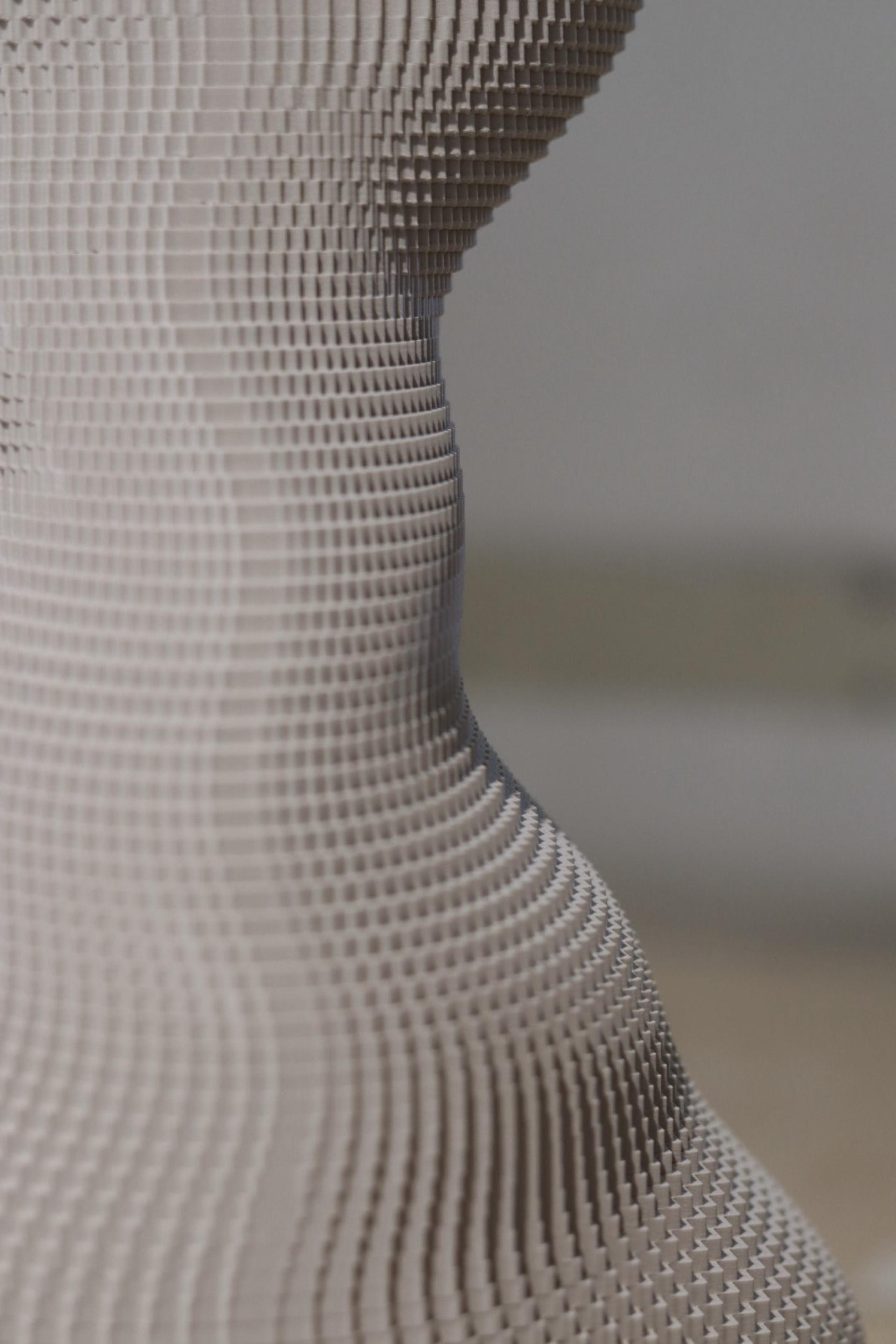 Sculpture featuring intricate, textured patterns showcasing innovative design at Dutch Design Week 2024, highlighting 3D printing techniques.
