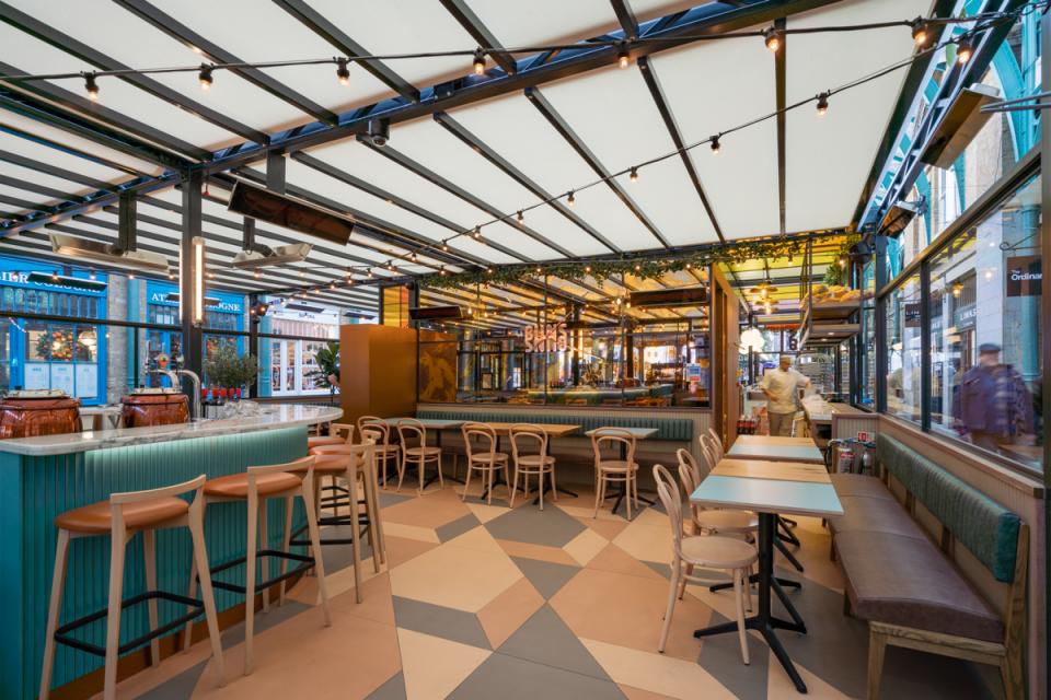 Vibrant interior of Buns & Buns restaurant in Covent Garden, featuring eclectic decor and stylish seating arrangements.