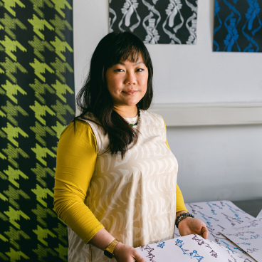 Eliza Kesuma showcases vibrant wallpaper designs from Moody Monday in her Edinburgh studio, emphasizing creativity and color.