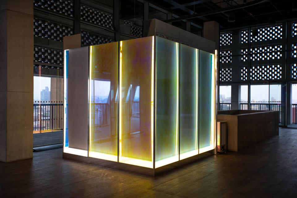 Interactive Lutron prismatic installation with illuminated panels, showcasing innovative design and lighting concepts for the creative community.