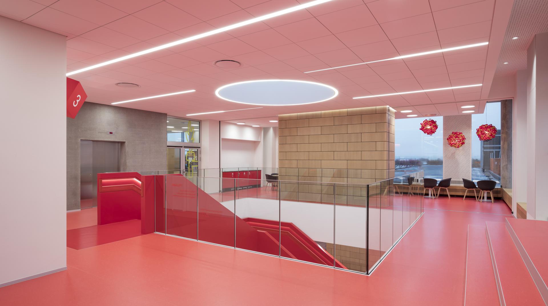 Brightly lit LEGO office interior featuring modern design elements, vibrant colors, and open spaces to foster creativity.