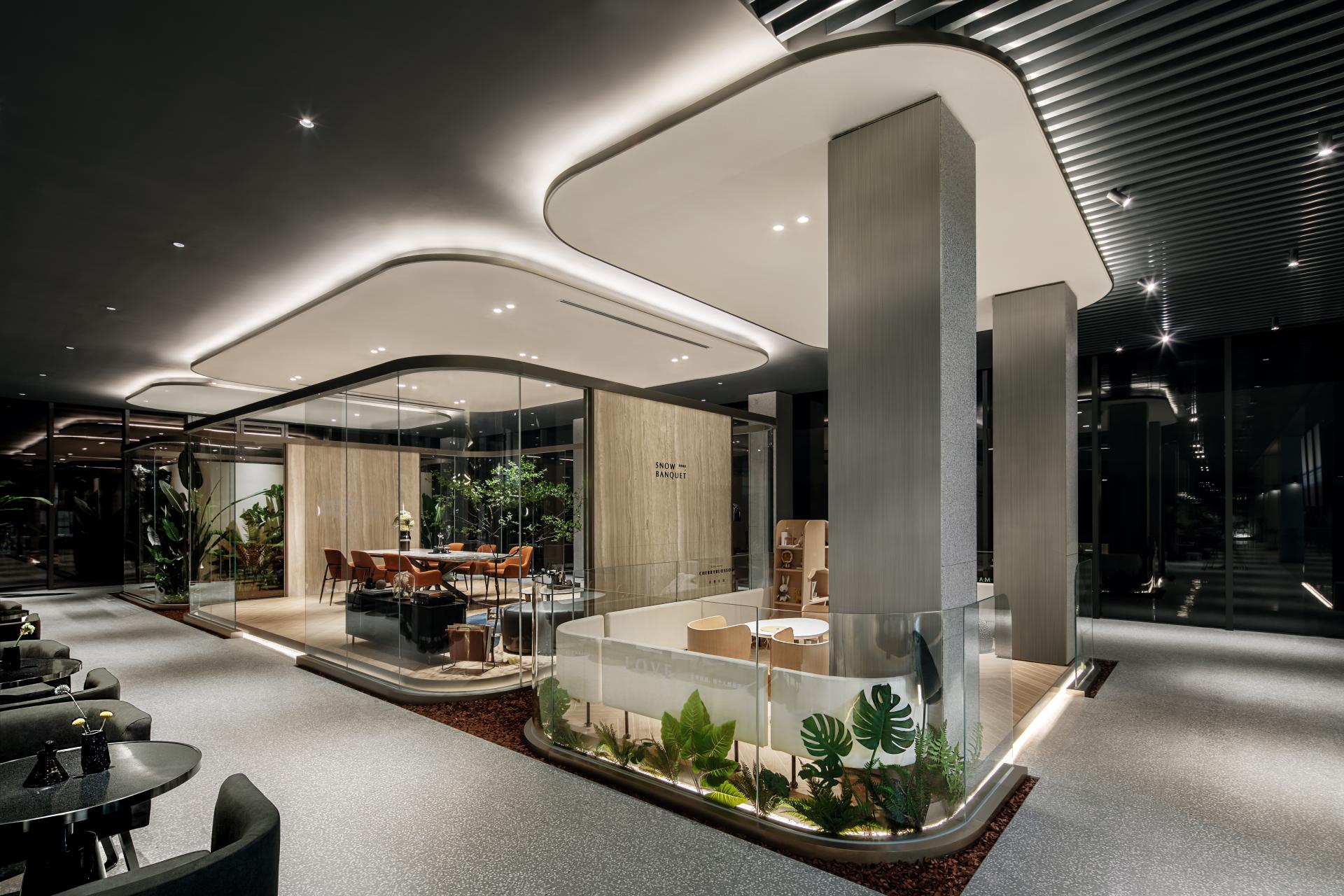 Elegant multi-media restaurant interior featuring nature-inspired design elements, modern furniture, and lush green plants.