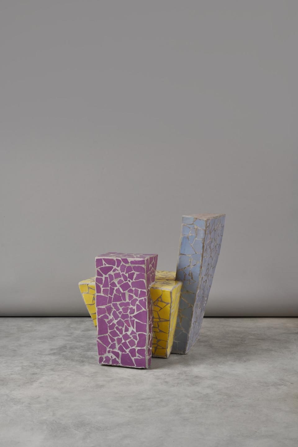 Vibrant, abstract chair design from Mas Creations, showcasing purple, yellow, and blue colors inspired by friendship.