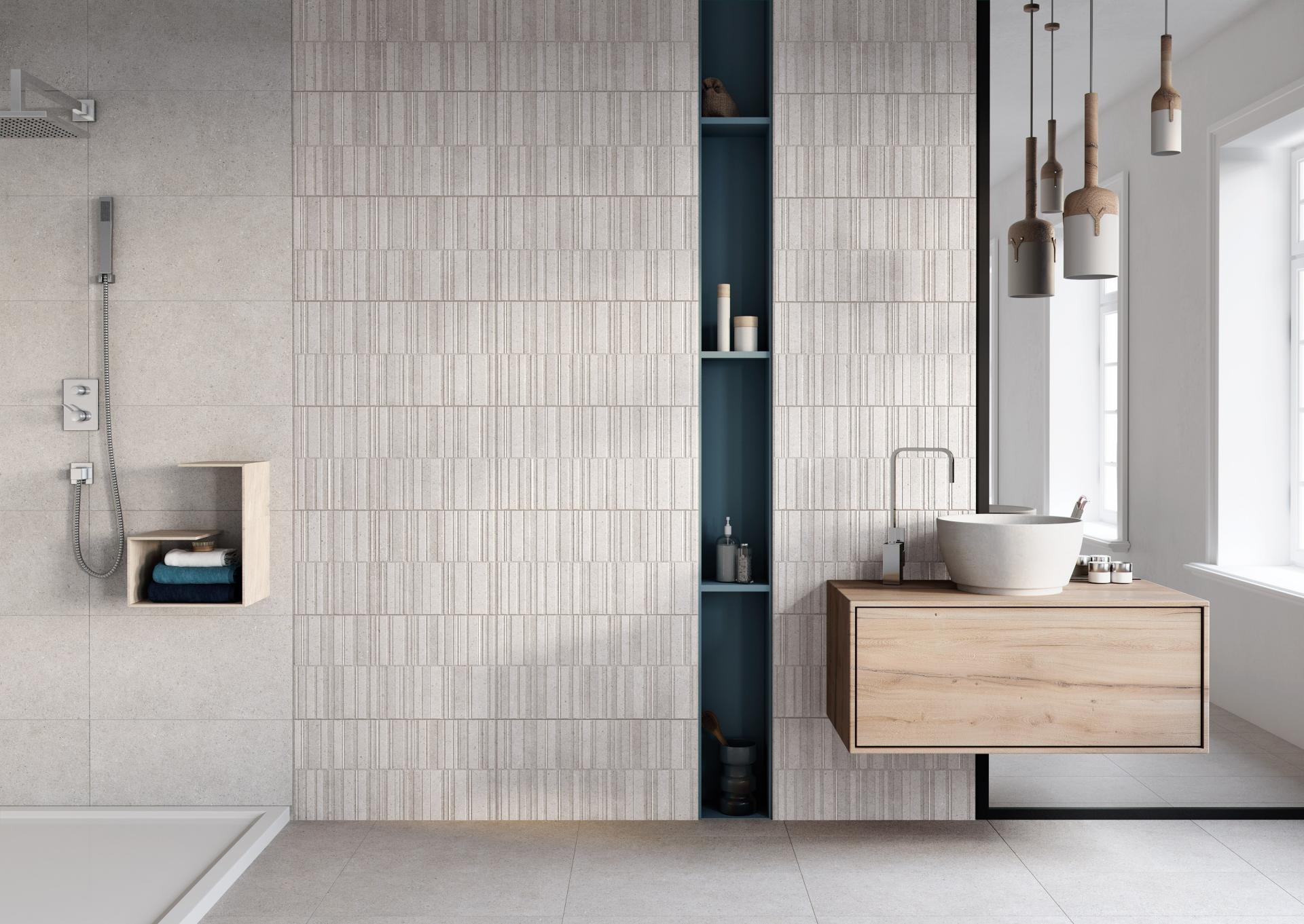 Modern bathroom design featuring textured tile walls, wooden vanity, and stylish pendant lighting showcasing 2019 tile trends.