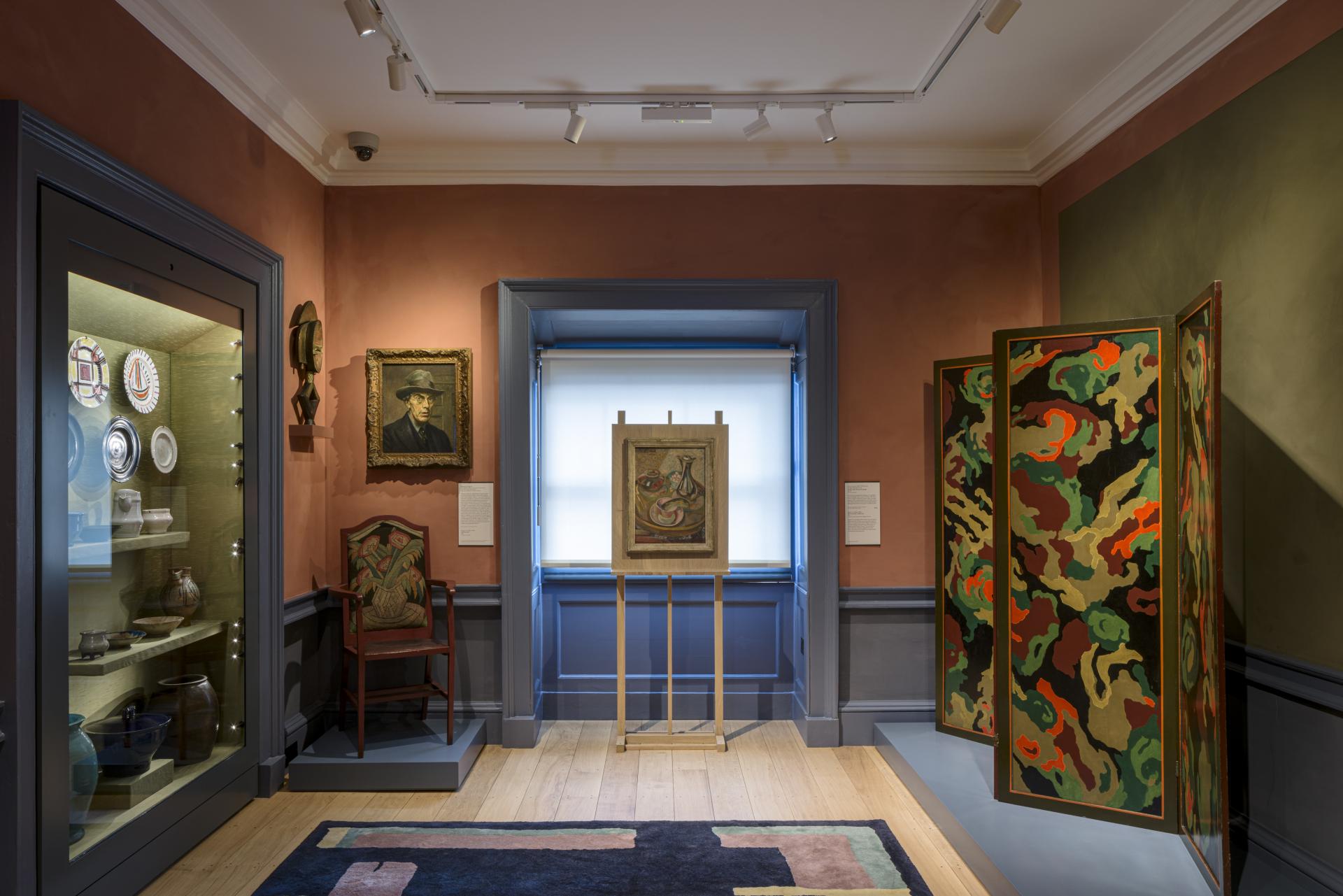 Gallery interior featuring historical artifacts, paintings, and decorative screens at The Courtauld Gallery's redesigned visitor experience.