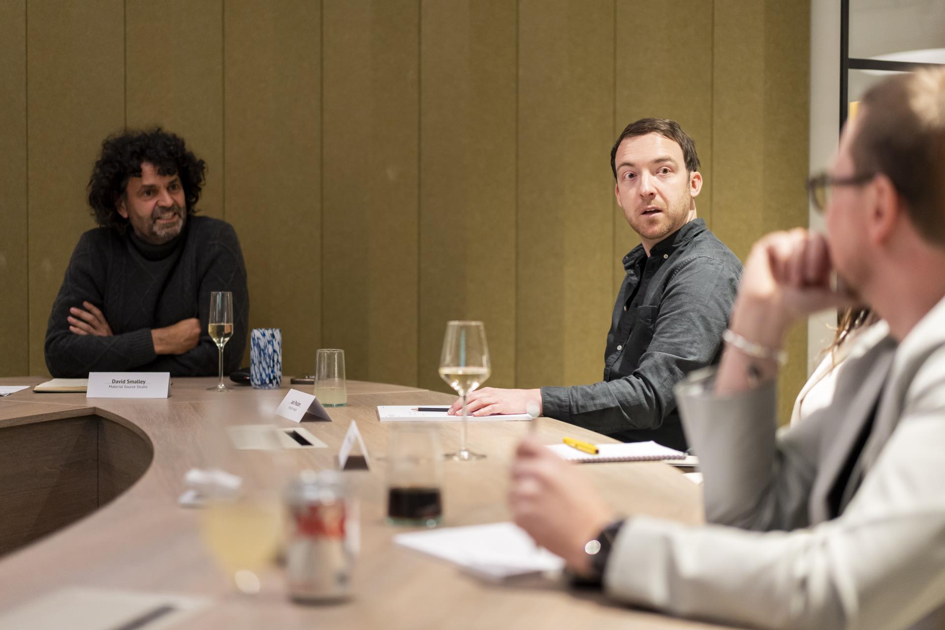 Design experts engage in a discussion about the impact of technology on sustainability in design.