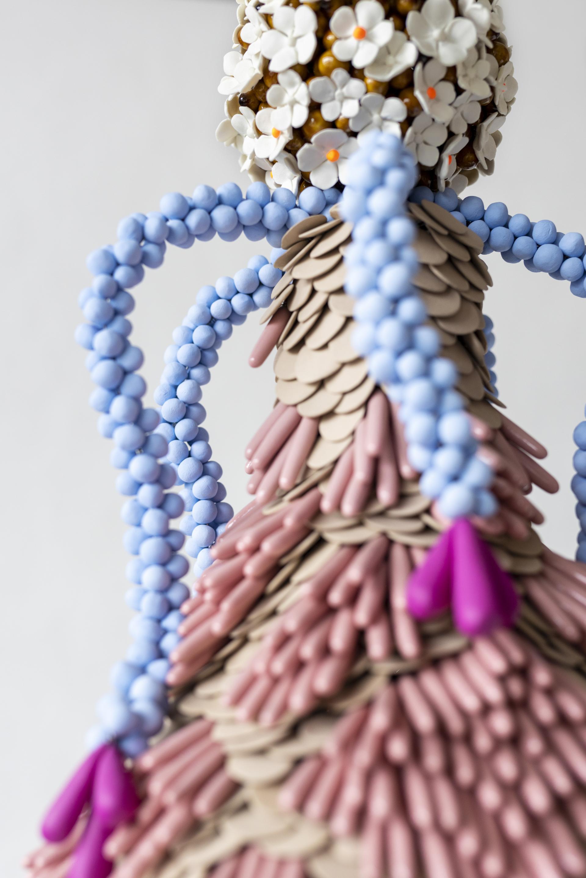 Colorful handmade sculpture adorned with flowers and beads, showcasing unique craftsmanship featured in London Craft Week 2024.