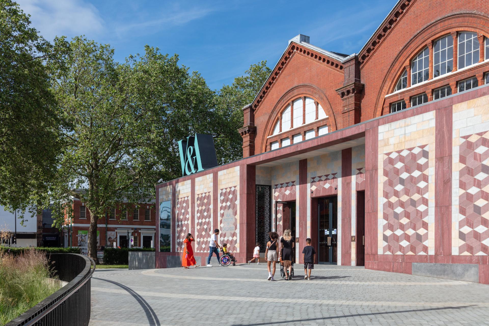 Families and children approach the Young V&A entrance, showcasing the museum's playful design in London.