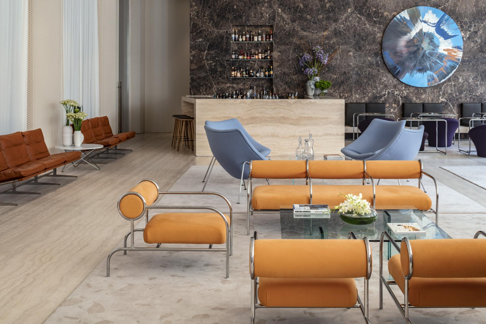 The stylish lobby of The Jaffa features minimalist furniture and a polished bar, designed by John Pawson.