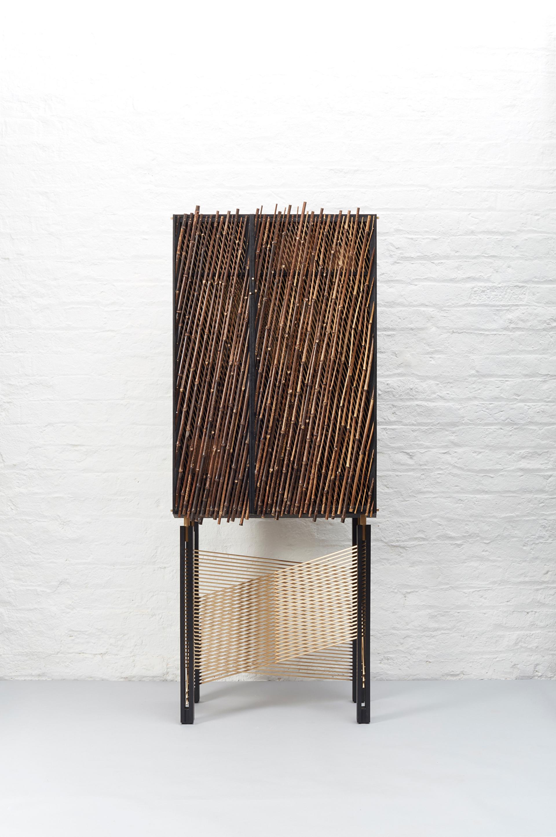 Elegant black-stained drinks cabinet 'In Shadows' by Hugh Miller, featuring a unique bamboo-inspired design.