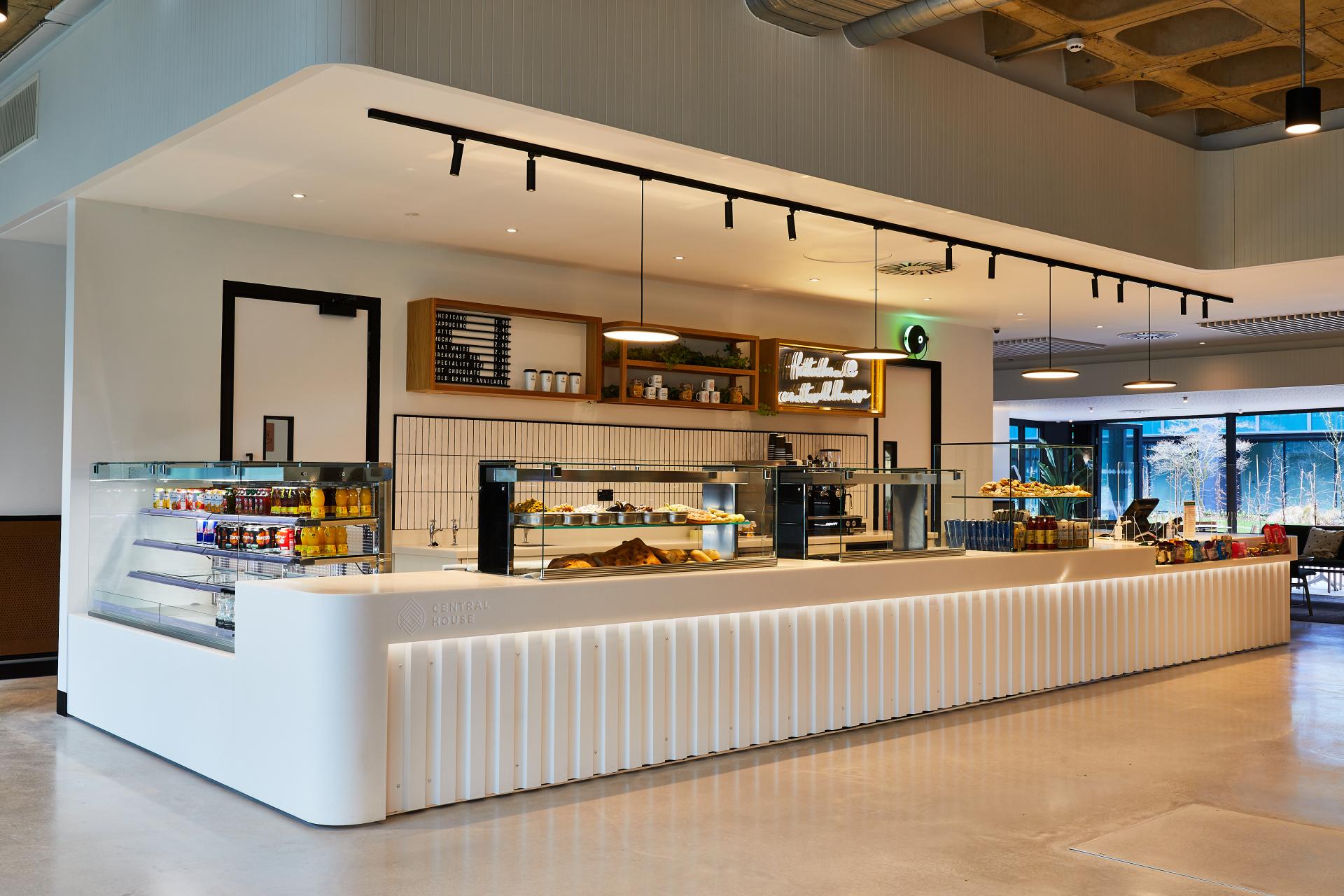 Elegant café counter at Central House, Harrogate, designed by SpaceInvader for an inviting communal space.