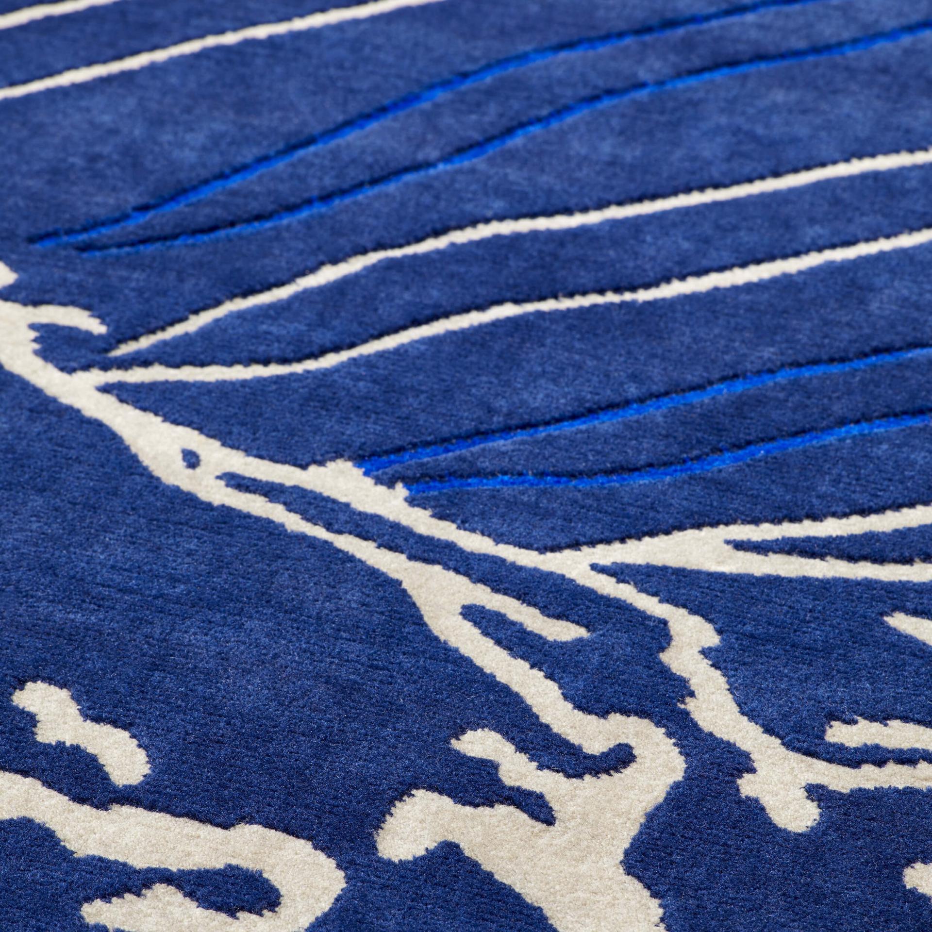 Textured blue rug showcasing organic patterns, highlighting NoChintz's focus on materiality and design storytelling.