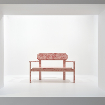 Artwork featuring a pink bench with intricate designs, displayed in a contemporary gallery setting at the National Gallery of Victoria.