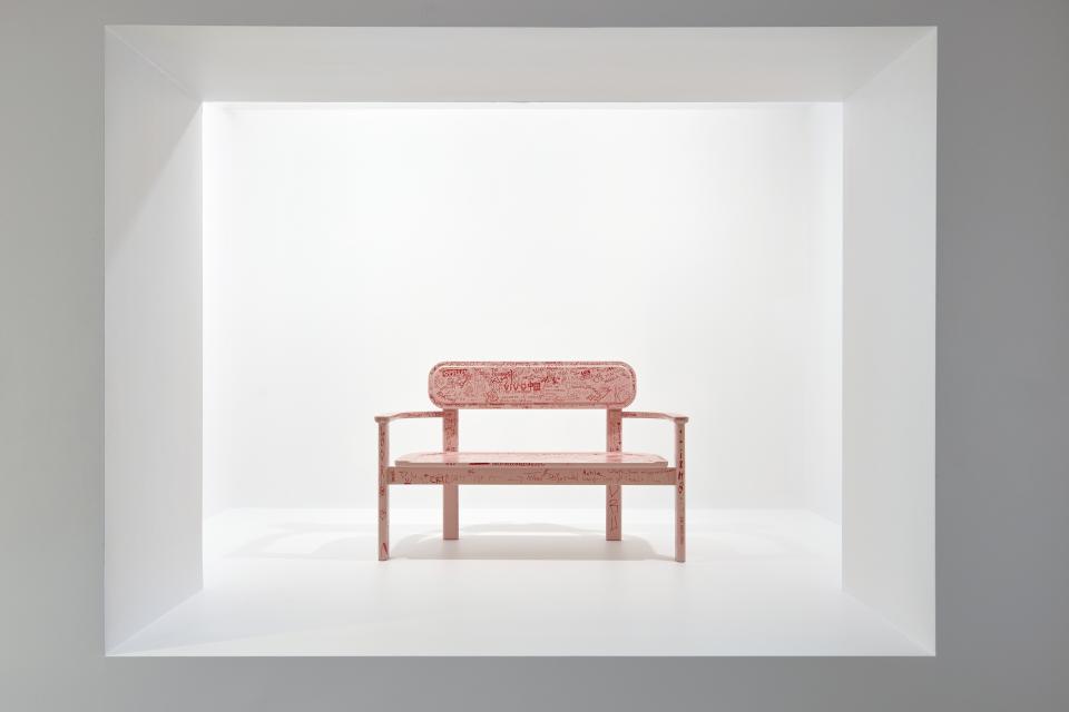 Artwork featuring a pink bench with intricate designs, displayed in a contemporary gallery setting at the National Gallery of Victoria.