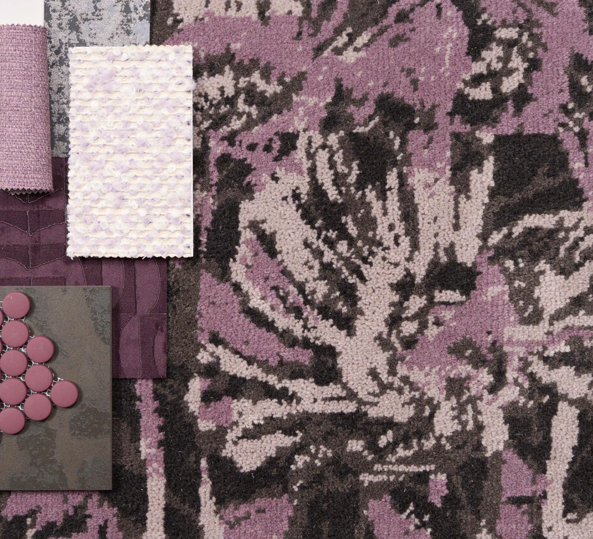 A collection of textured fabrics and carpet samples in purple tones, inspired by Lancashire and Yorkshire landscapes.