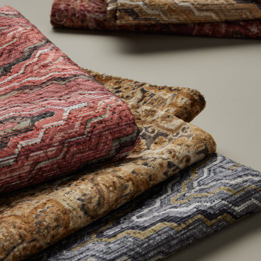 Luxurious structured jacquard fabrics in rich colors and textures, ideal for hospitality upholstery by Panaz.
