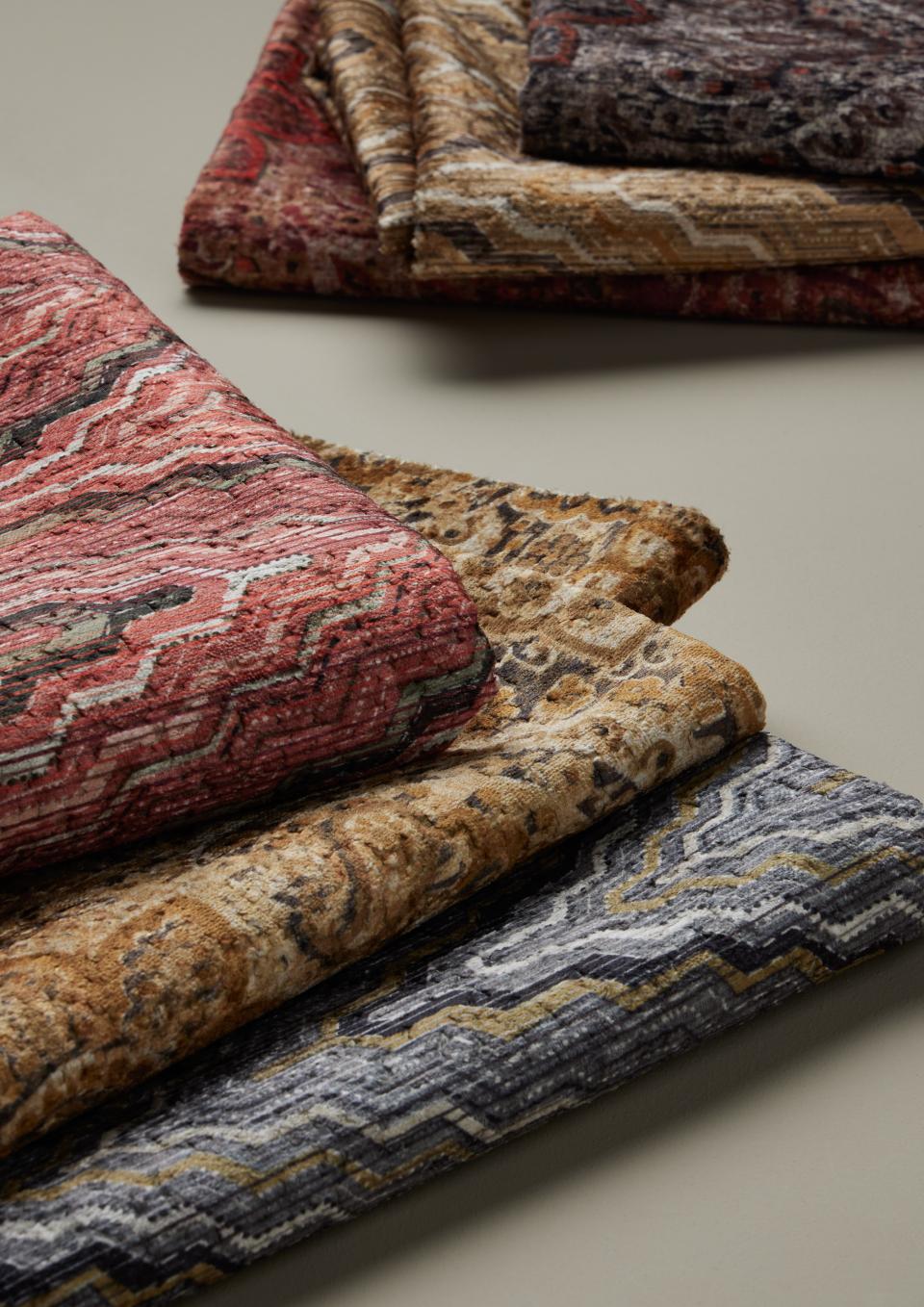 Luxurious structured jacquard fabrics in rich colors and textures, ideal for hospitality upholstery by Panaz.