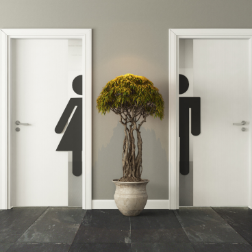 Washroom doors with gender symbols, highlighting key updates in planning guidance and building regulations.