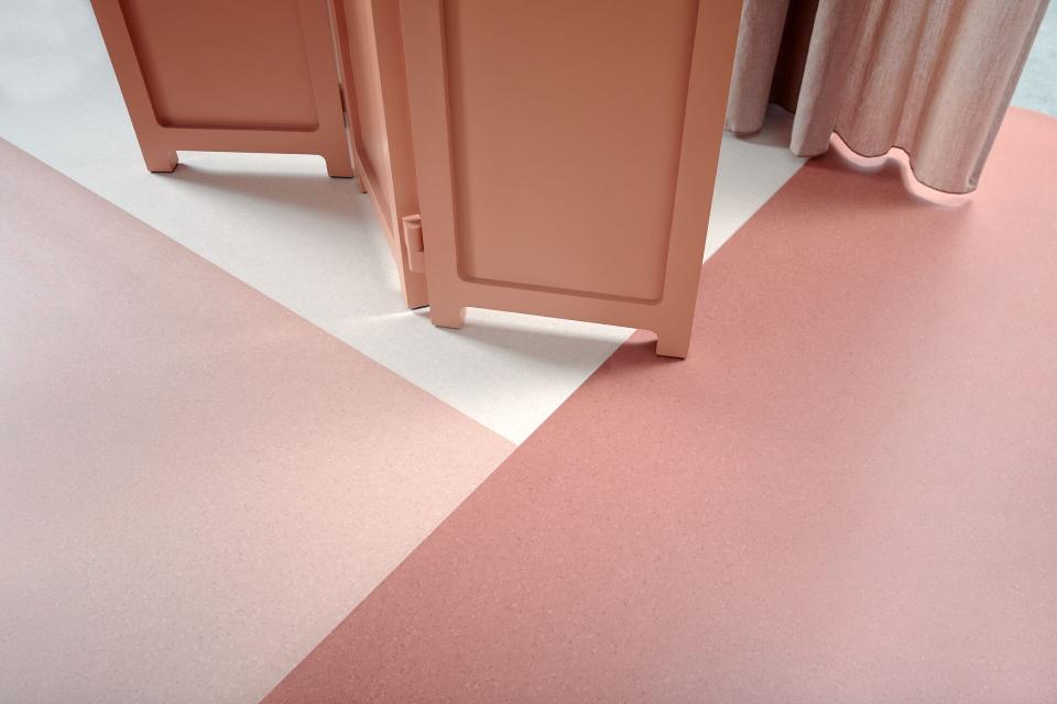 Homogeneous vinyl flooring featuring soft pink and white hues, designed for modern healthcare environments by Forbo.