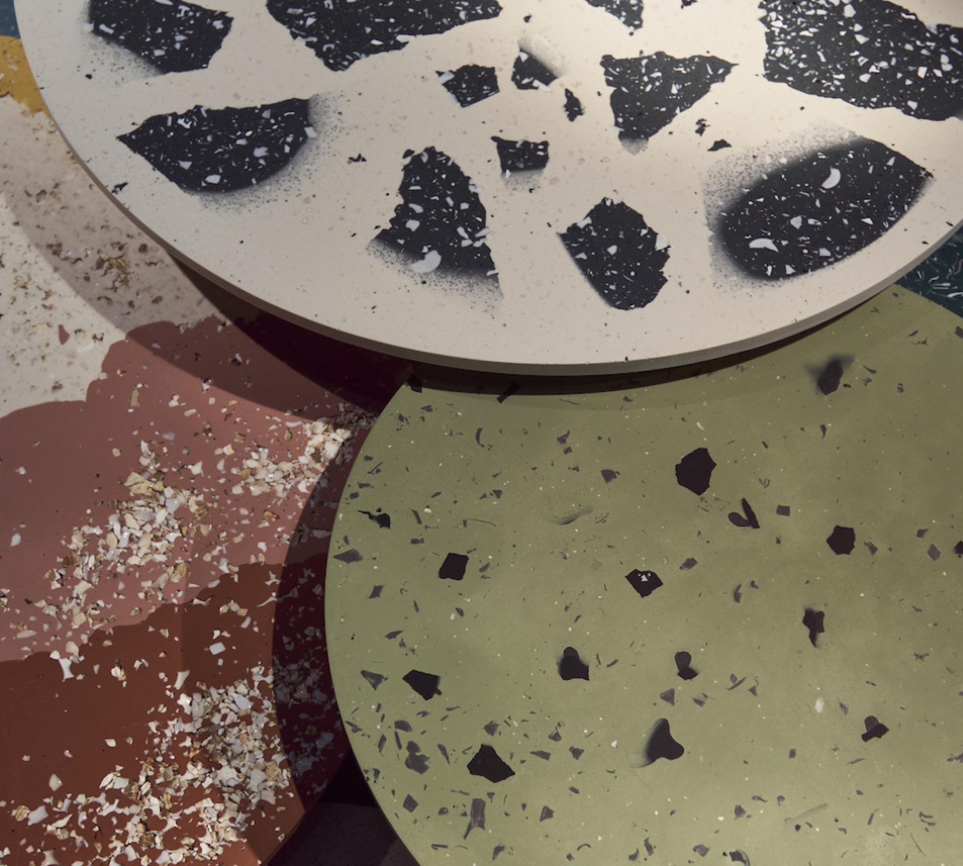Sustainable biomaterials displayed in various textured circular surfaces showcasing innovative design at LDF22.