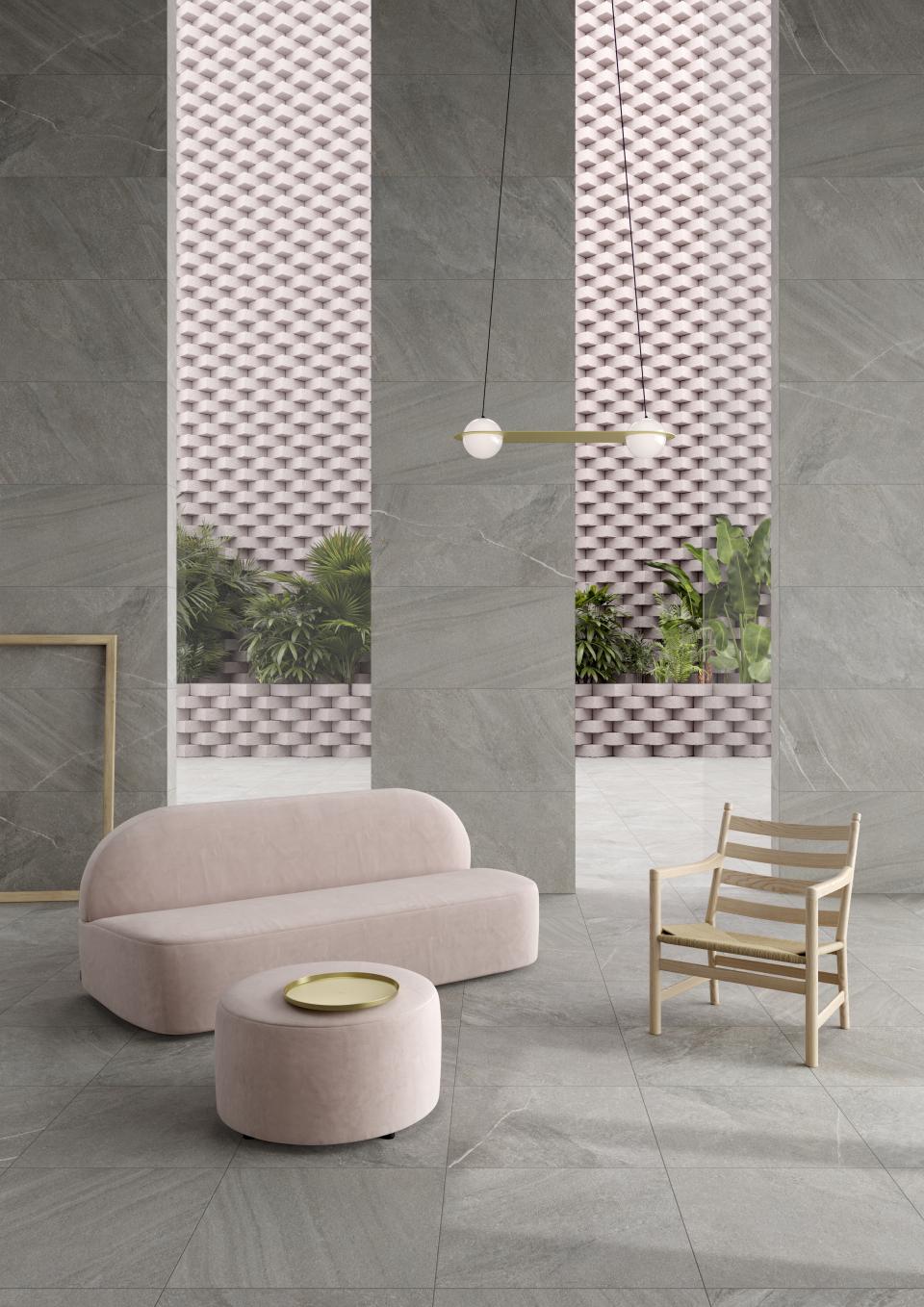 Stylish interior showcasing VitrA's textured tiles, modern furniture, and a unique color palette at Cersaie 2018.