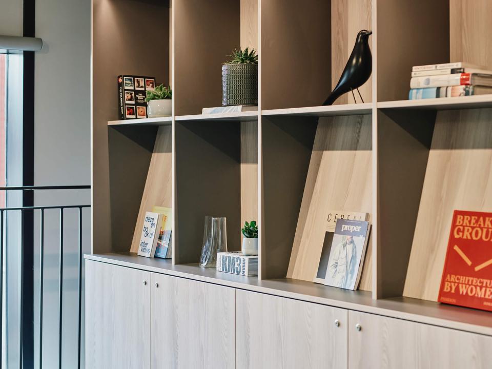 Modern bookshelf display in The Tannery, featuring decor and books in Leicester's contemporary student living space.