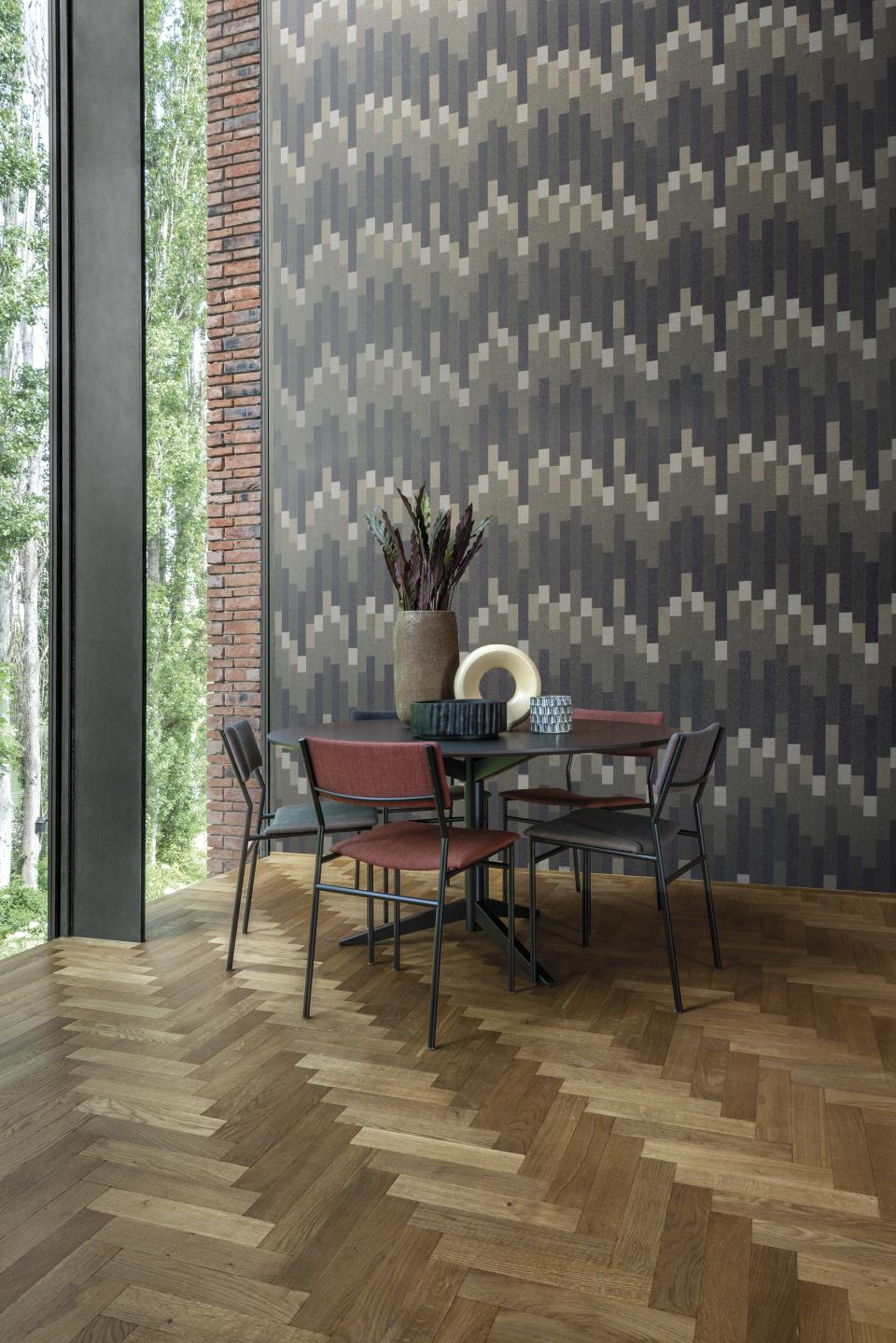Stylish dining area featuring Omexo wallcovering, modern furniture, and sustainable wood flooring in a natural setting.