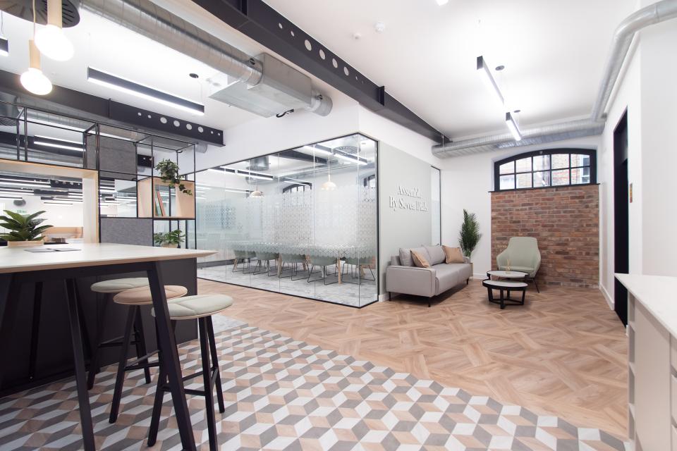 Modern office space interior featuring IVC Commercial's modular vinyl flooring at Assemble by Seven Dials, showcasing a collaborative environment.