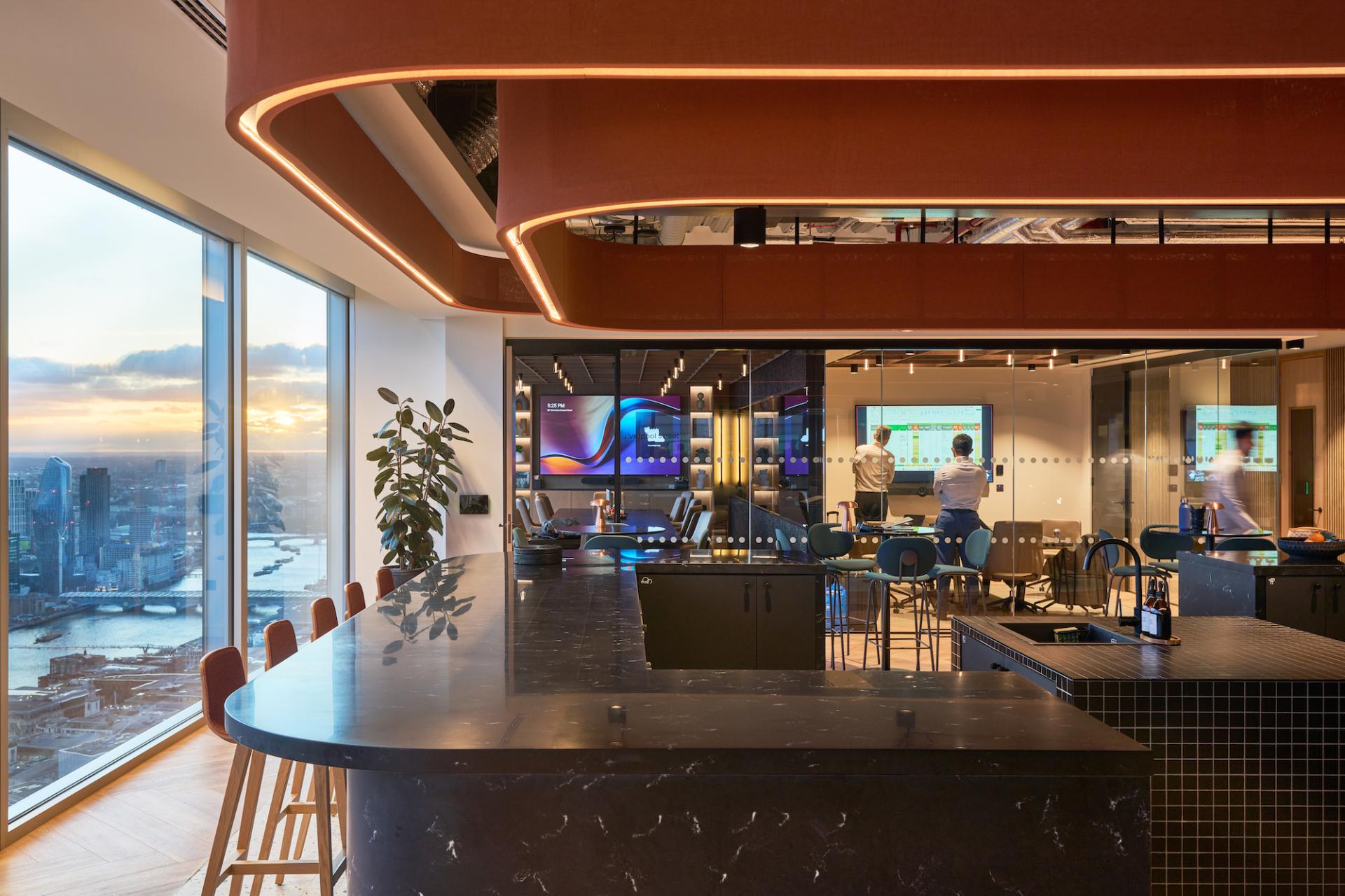 Modern workspace design showcasing a collaborative area at Bentley Systems, featuring sleek furniture and advanced technology.