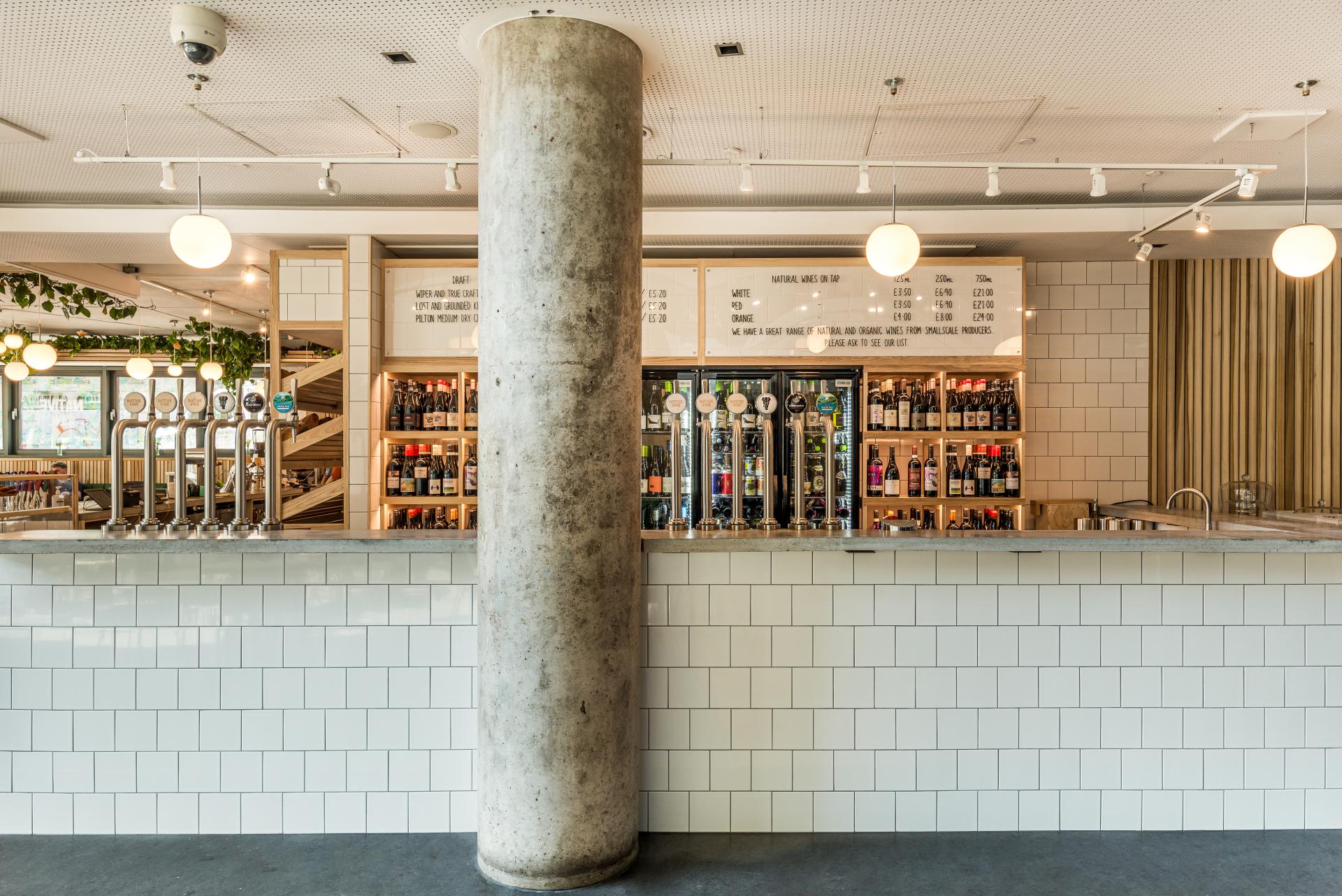 Stylish café counter at Bristol Loaf in Bristol Beacon, featuring a variety of drinks and modern décor.