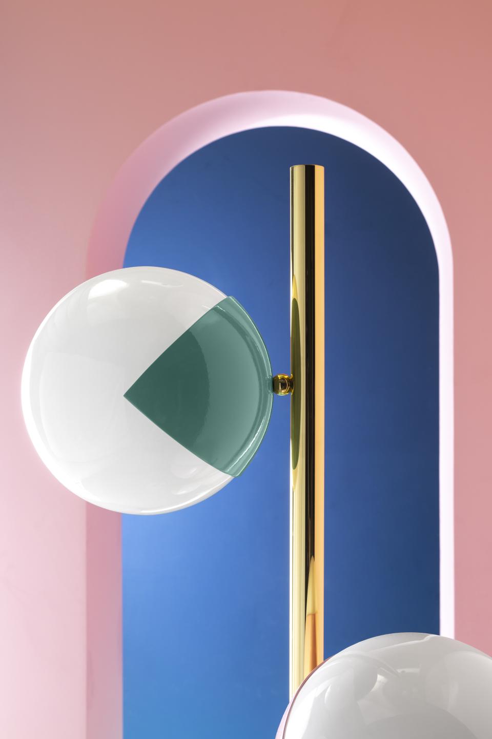 Colorful globes atop sleek golden stems, showcasing unique 'eyeball' lamp designs from the Pop-Up collection by Magic Circus Éditions.